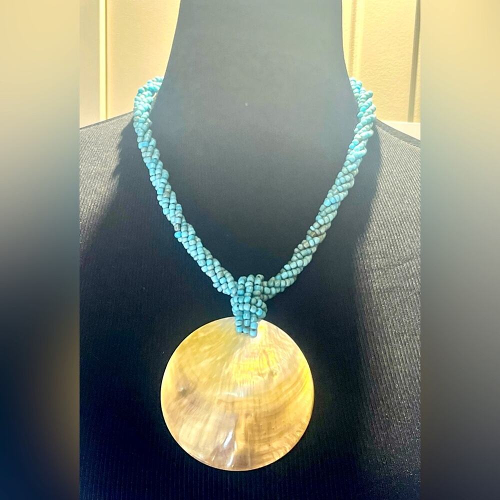Turquoise-colored braided shell necklace